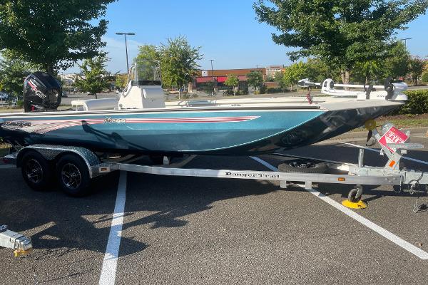 Ranger RB200 2024 Ranger RB200 boat on trailer in parking lot.