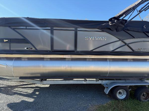Sylvan X-3 CLZ 2025 Sylvan X-3 CLZ pontoon boat on trailer, side view, black and silver design.