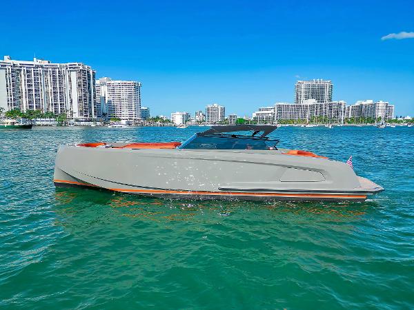 Vanquish Yachts VQ 45 Vanquish Yachts VQ 45, 2021 model, cruising in a vibrant coastal cityscape.