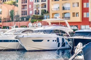 Princess 68 Luxury yacht Princess 68, 2016 model, docked in a vibrant marina setting.
