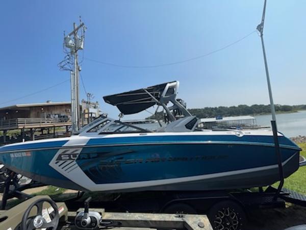 Nautique Super Air Nautique G23 2017 Nautique Super Air Nautique G23 boat by the lake on a sunny day.
