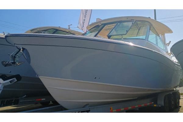Grady-White Freedom 345 2025 Grady-White Freedom 345 boat on trailer, side view, sunny day.
