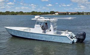 Custom Custom 33 Center Console 2012 Contender Custom 33 Center Console boat on calm water, clear sky background.