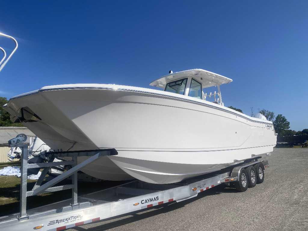 Caymas 34 CT 2025 Caymas 34 CT boat on trailer under clear blue sky.