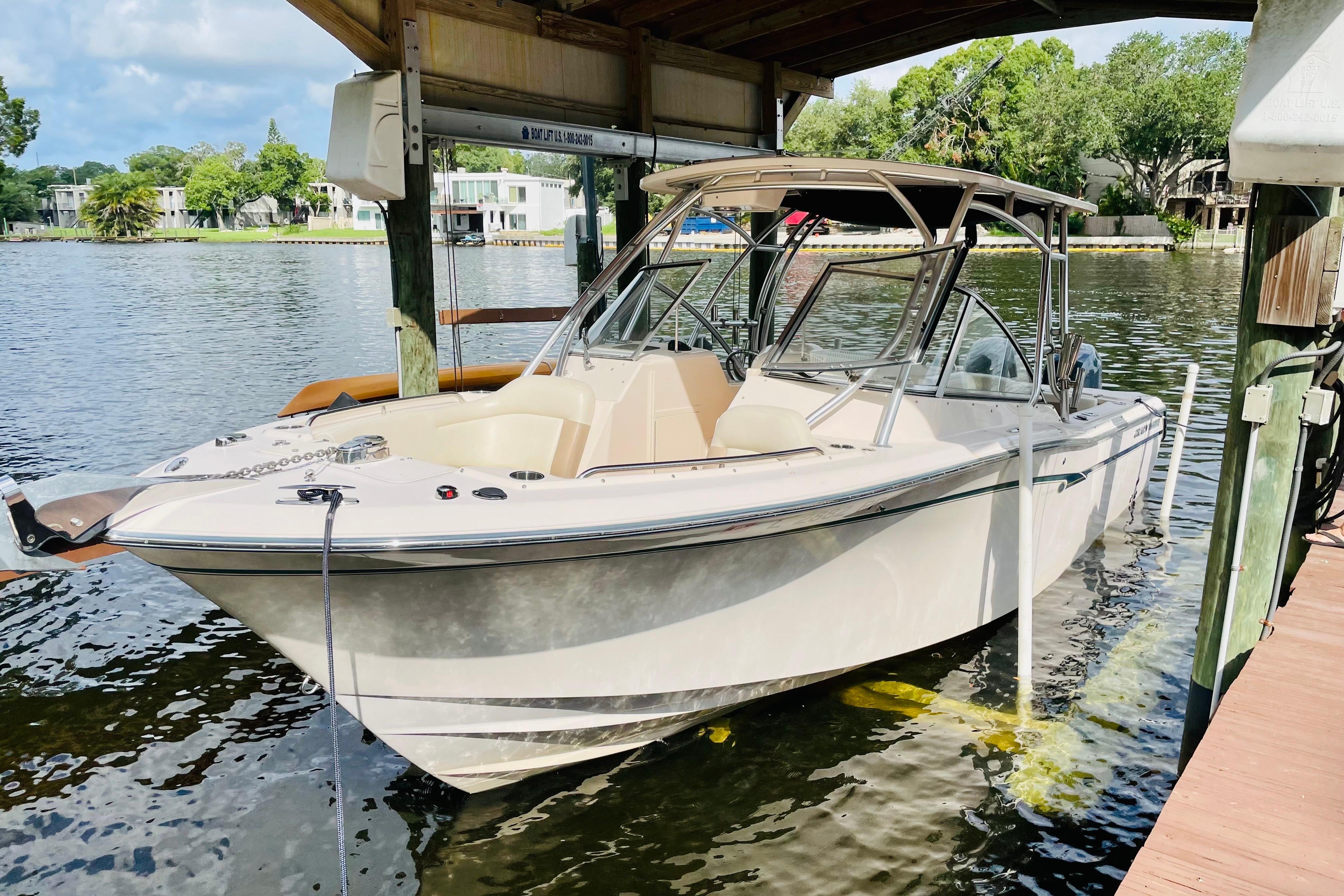 Grady-White Freedom 275 2014 Grady-White Freedom 275 boat docked on a serene waterfront.