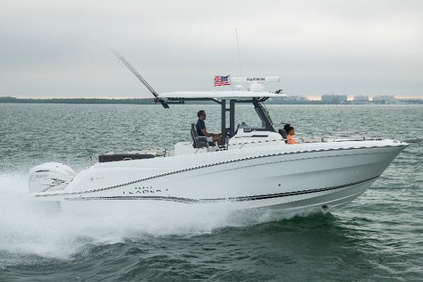 Jeanneau Leader 10.5 CC 2024 Jeanneau Leader 10.5CC cruising on open water, side view.