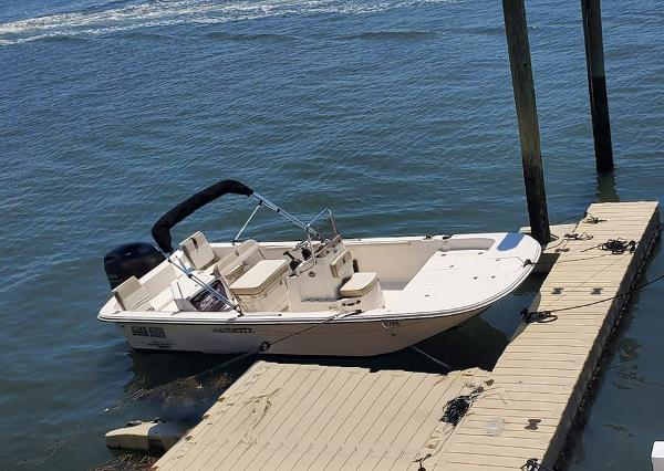 Carolina Skiff 19LS 2020 Carolina Skiff 19LS boat docked on calm water.