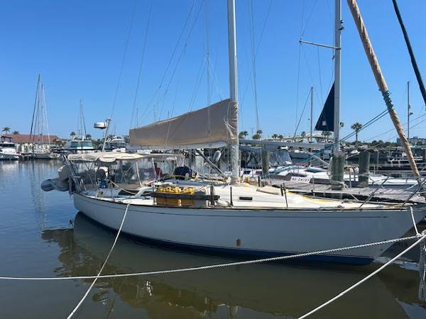 Sabre 38 1988 Sabre 38 sailboat docked at a marina on a sunny day.