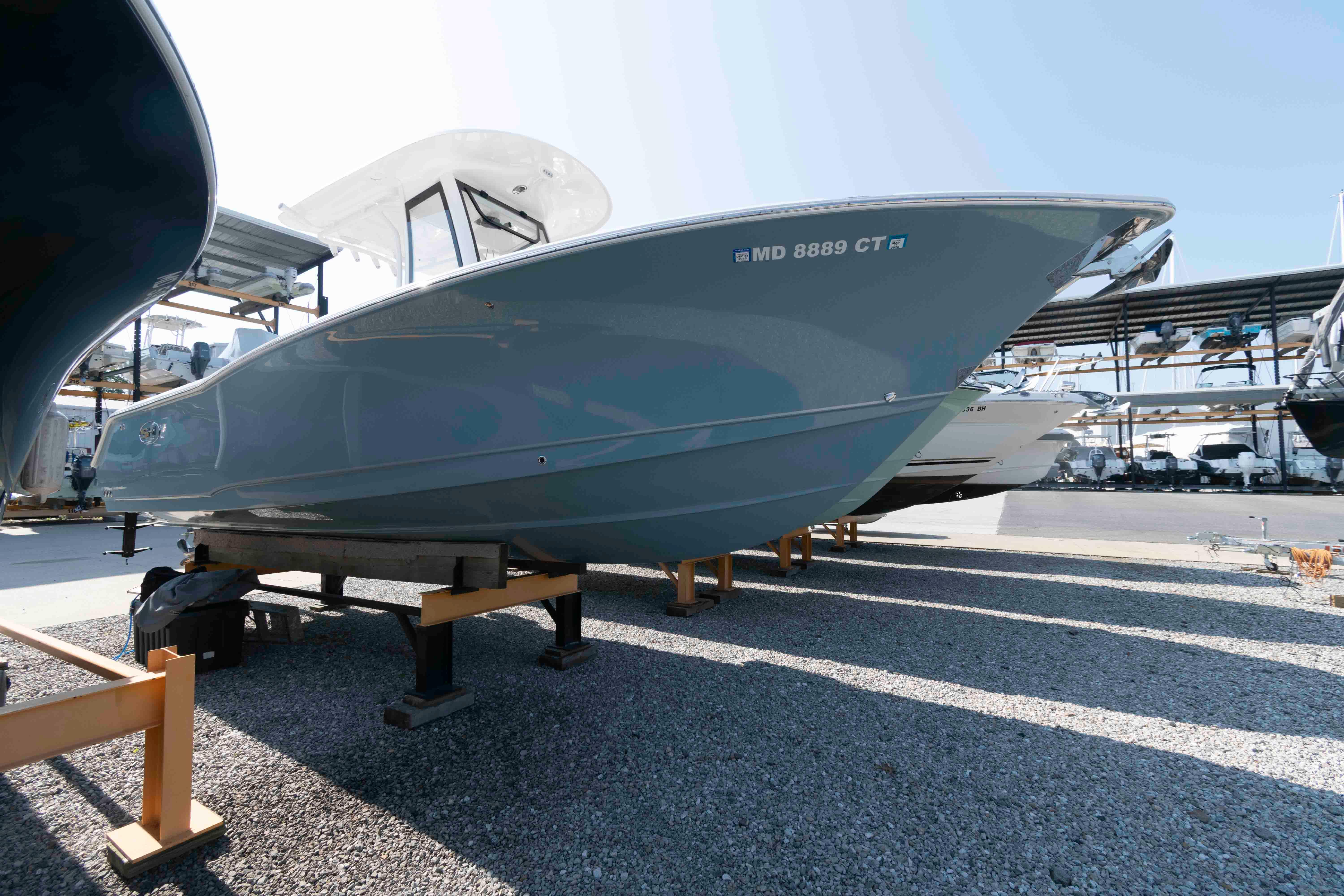 Sea Hunt Ultra 275 SE 2023 Sea Hunt Ultra 275 SE boat on display in a marina.