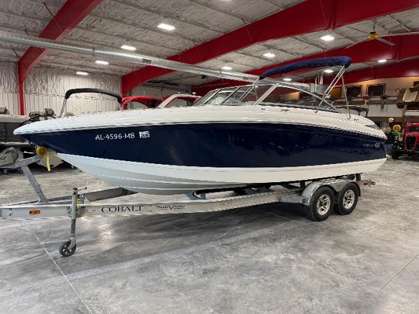Cobalt 242 2011 Cobalt 242 boat on trailer in indoor storage facility.