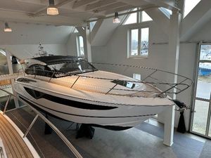 Princess V40 Sunbed 2024 Princess V40 Sunbed yacht displayed indoors, showcasing sleek design and modern features.
