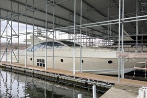 Azimut 68S Luxury 2006 Azimut 68S yacht docked under covered marina.
