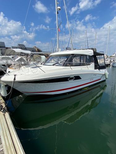Beneteau Antares 8.80 2016 Beneteau Antares 8.80 boat docked in a marina under a blue sky.