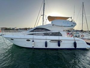 Astondoa 39 2002 Astondoa 39 yacht docked in marina at sunset.