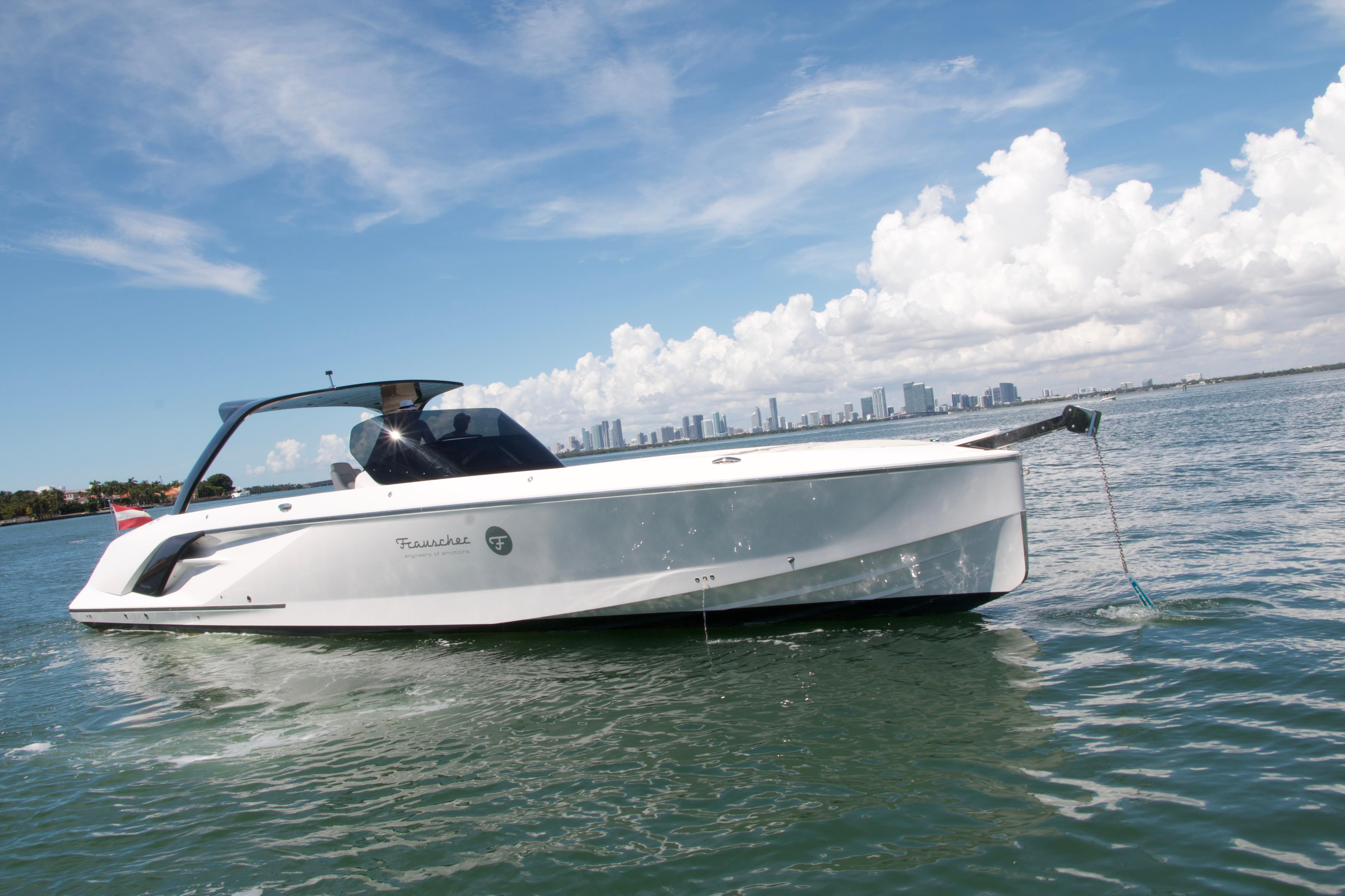 Frauscher 1414 Demon 2020 Frauscher 1414 Demon luxury yacht cruising on open water under a clear sky.