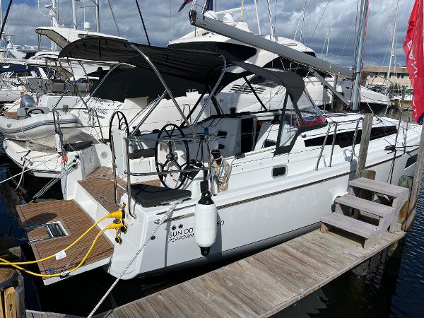 Jeanneau Sun Odyssey 350 2025 Jeanneau Sun Odyssey 350 sailboat docked at marina under cloudy skies.