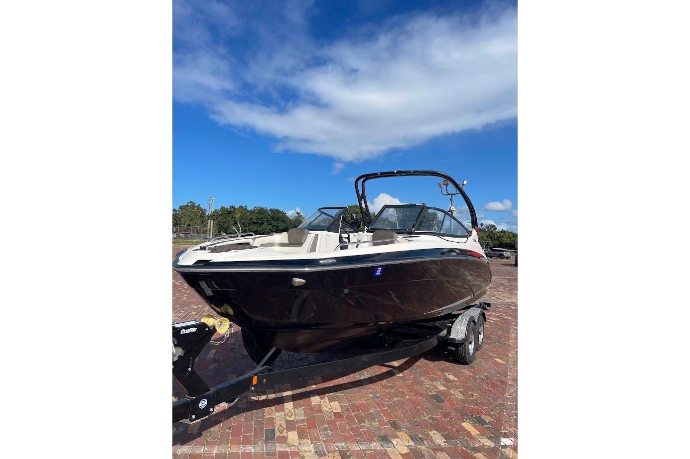 Yamaha Boats 242 Limited S 2015 Yamaha Boats 242 Limited S on trailer, under clear blue sky.
