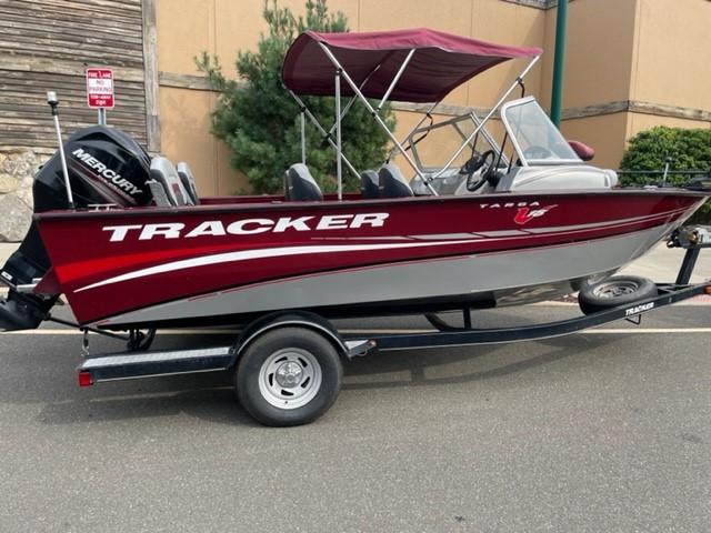 Tracker Targa V-18 Combo 2014 Tracker Targa V-18 Combo boat with red and silver design on a trailer.