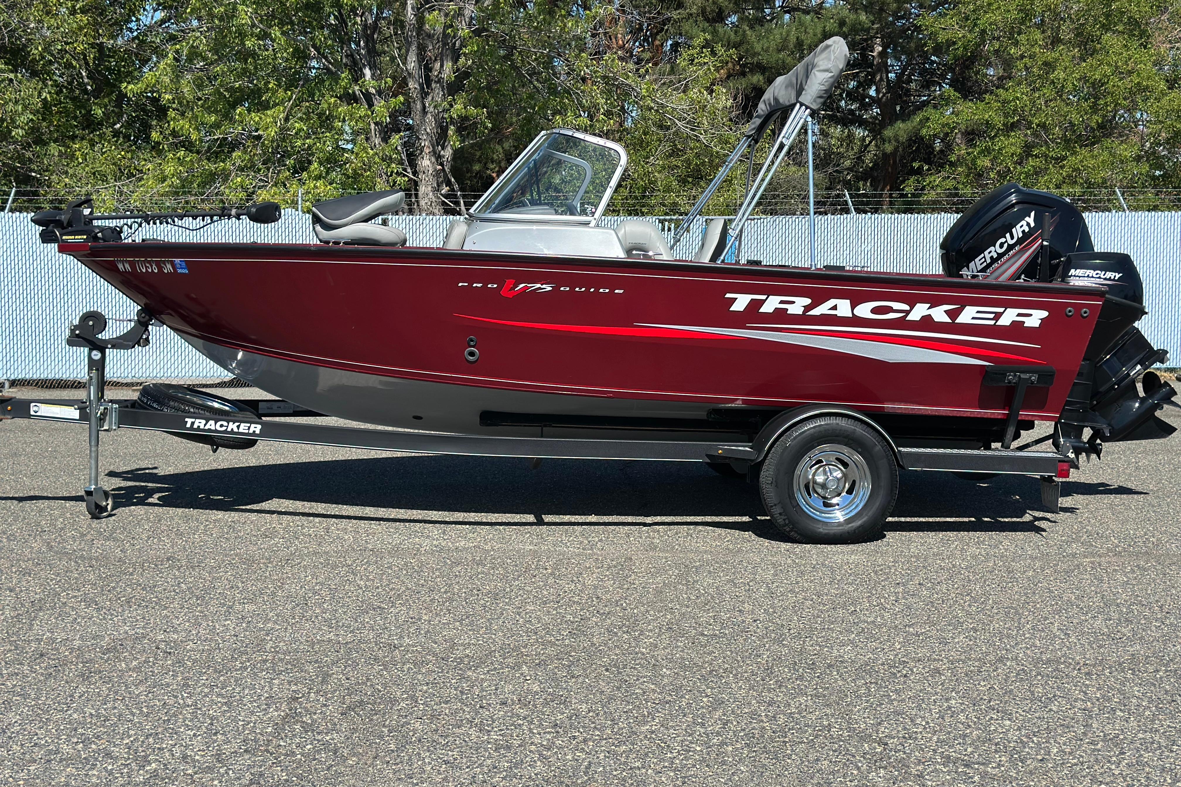 Tracker Pro Guide V-175 WT 2018 Tracker Pro Guide V-175 WT boat on trailer, red exterior, parked outdoors.