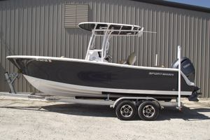 Sportsman Open 232 Center Console 2022 Sportsman Open 232 Center Console boat on trailer, parked outdoors.