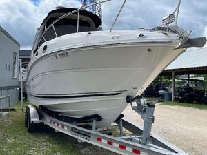 Sea Ray 260 Sundancer 2006 Sea Ray 260 Sundancer boat on trailer, parked outdoors under cloudy sky.