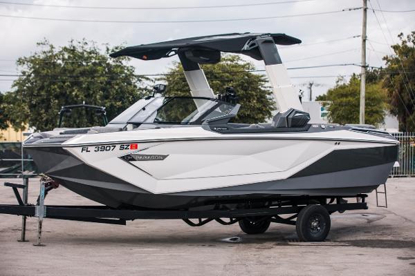 Nautique G23 PARAGON 2021 Nautique G23 PARAGON boat on a trailer, side view.