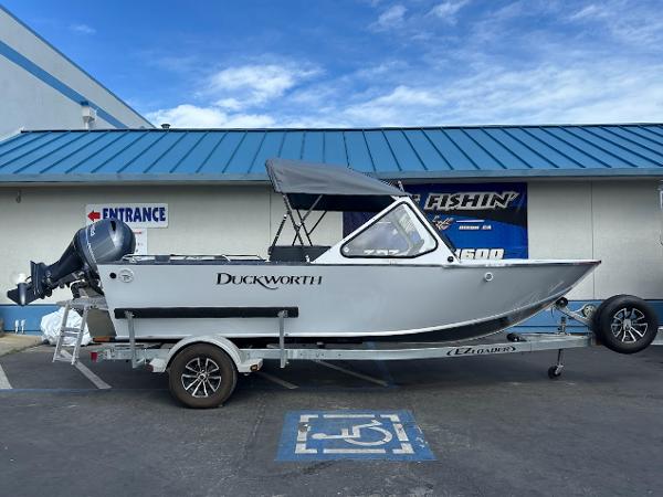 Duckworth 18 Advantage 2025 Duckworth 18 Advantage boat on trailer, parked in a lot with blue roof background.