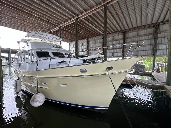Cheoy Lee 66 Long Range Motor Yacht 1986 Cheoy Lee 66 Long Range Motor Yacht docked in covered marina.