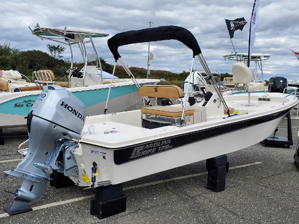 Carolina Skiff - With an overabundance of rod holders, a 3-tray stern  tackle system, a 20-gallon bait well, and a 100-quart removable cooler, the  23 Ultra Elite is built with fishing enthusiasts