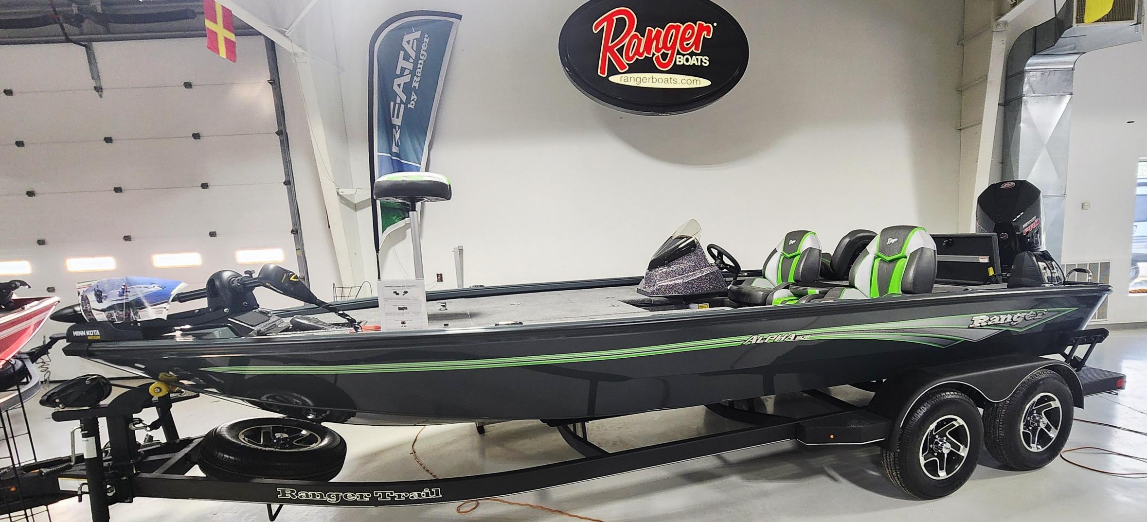 Ranger ALPHA 208 2025 Ranger ALPHA 208 boat on trailer in showroom, featuring sleek design and modern features.
