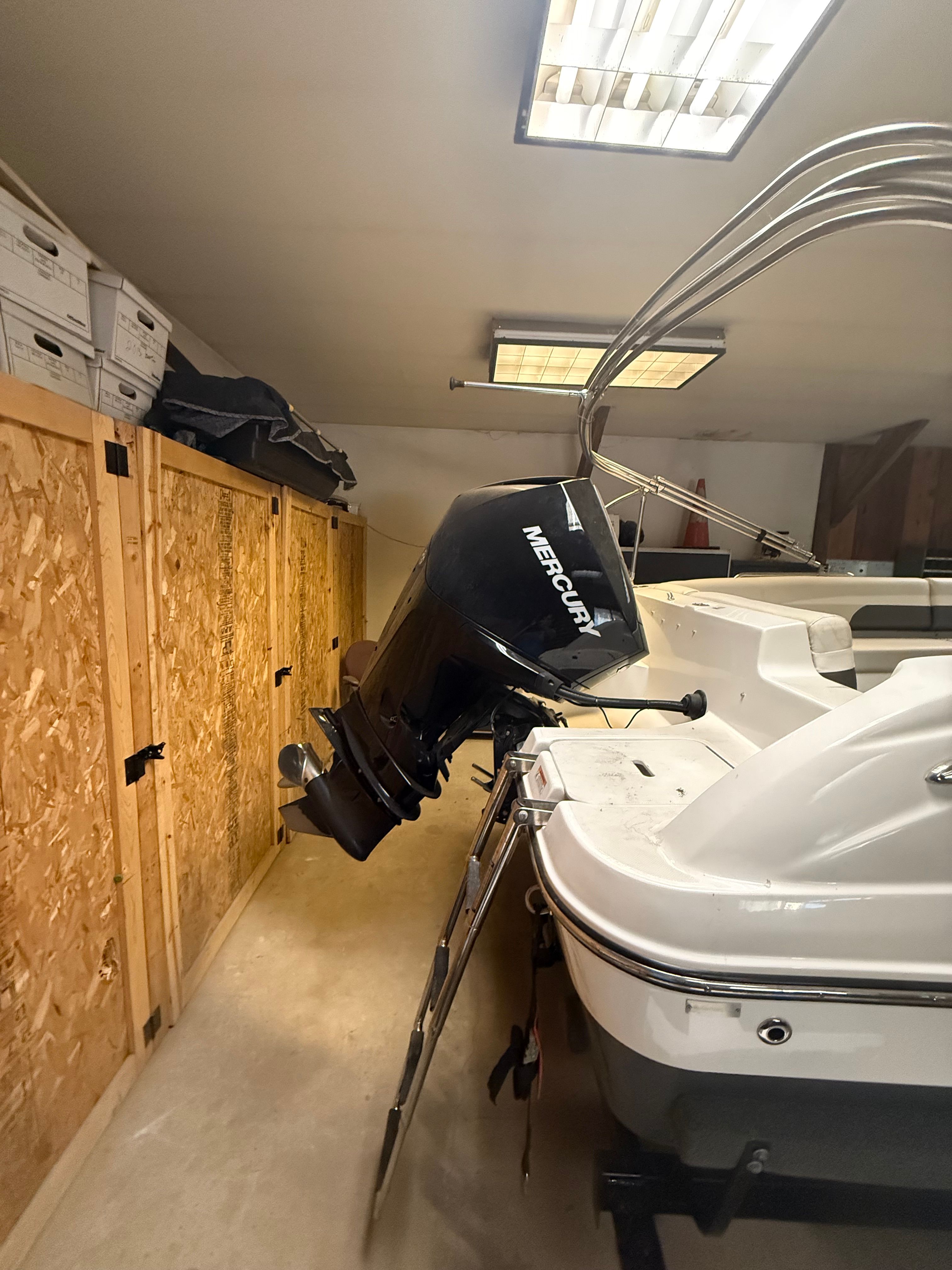 Hurricane SS201 2019 Hurricane SS201 boat with Mercury outboard motor in storage.