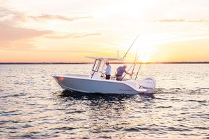 Sailfish 232 CC 2026 Sailfish 232 CC boat on water at sunset, two people fishing.