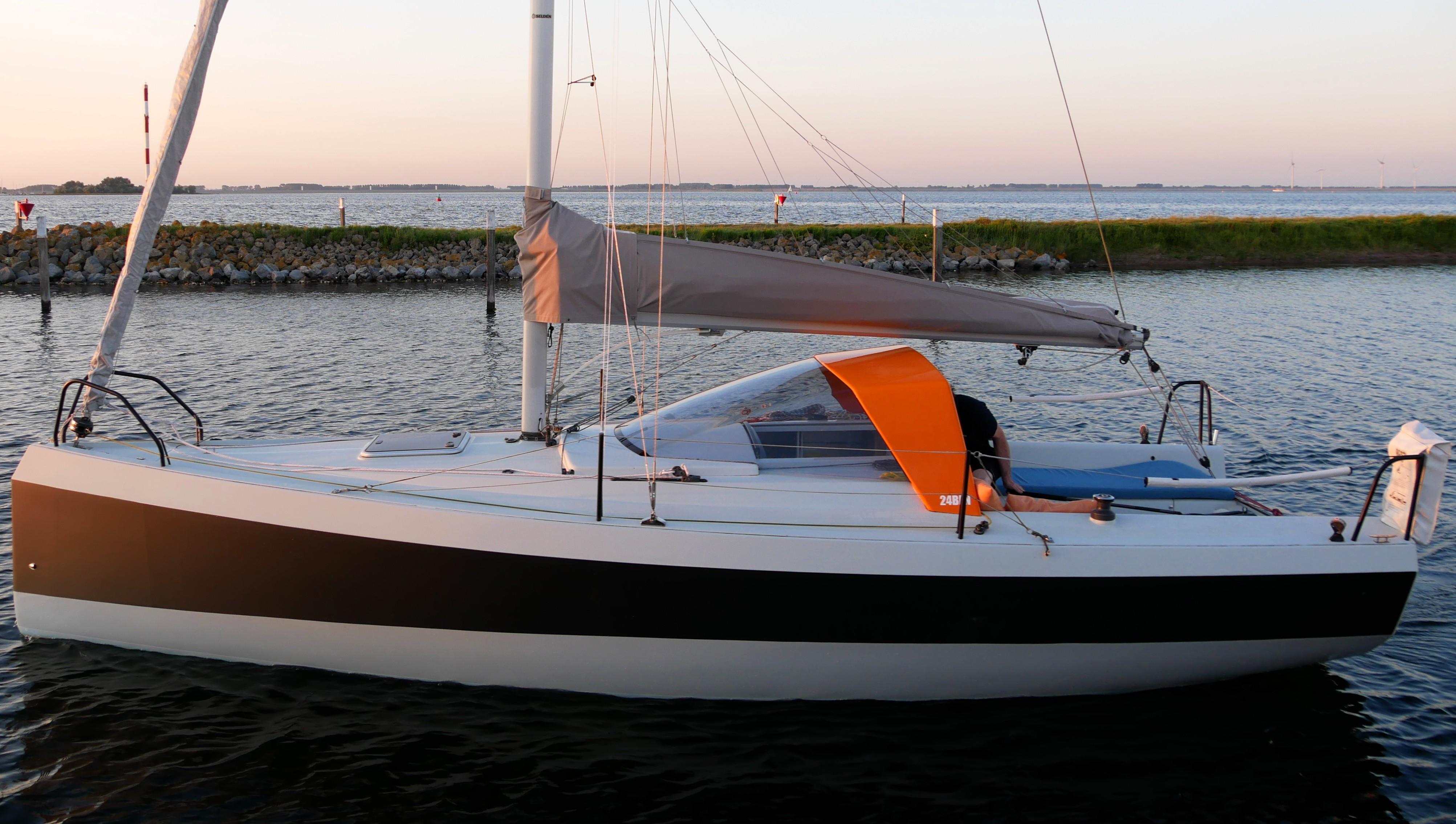 Bente 24 Sailboat Bente 24, 2016 model, docked at sunset on calm waters.