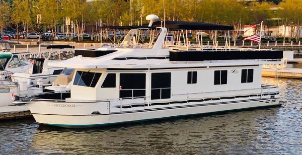 Legacy Yachts Majestic 2007 Legacy Yachts Majestic docked in a marina, featuring sleek design and spacious deck.