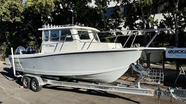 Defiance ADMIRAL 260EX 2025 Defiance ADMIRAL 260EX boat on trailer, parked outdoors.