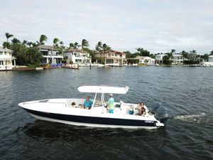 Intrepid 323 Cuddy 2005 Intrepid 323 Cuddy cruising near waterfront homes on a sunny day.