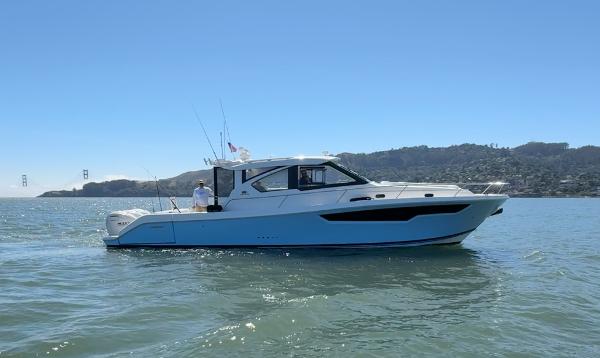 Pursuit OS 445 Offshore 2025 Pursuit OS 445 Offshore boat cruising on a sunny day.