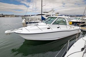 Boston Whaler 345 Conquest. 2008 Boston Whaler 345 Conquest boat docked in marina, side view.