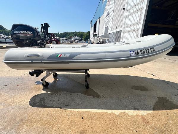 AB Inflatables AB 11 2021 AB Inflatables AB 11 boat with Mercury outboard motor on a trailer.
