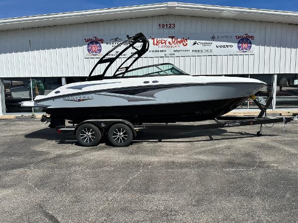 Monterey M22 2025 Monterey M22 boat on trailer outside dealership.