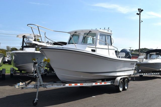 Steiger Craft 23 Miami 2026 Steiger Craft 23 Miami boat on trailer, parked outdoors.