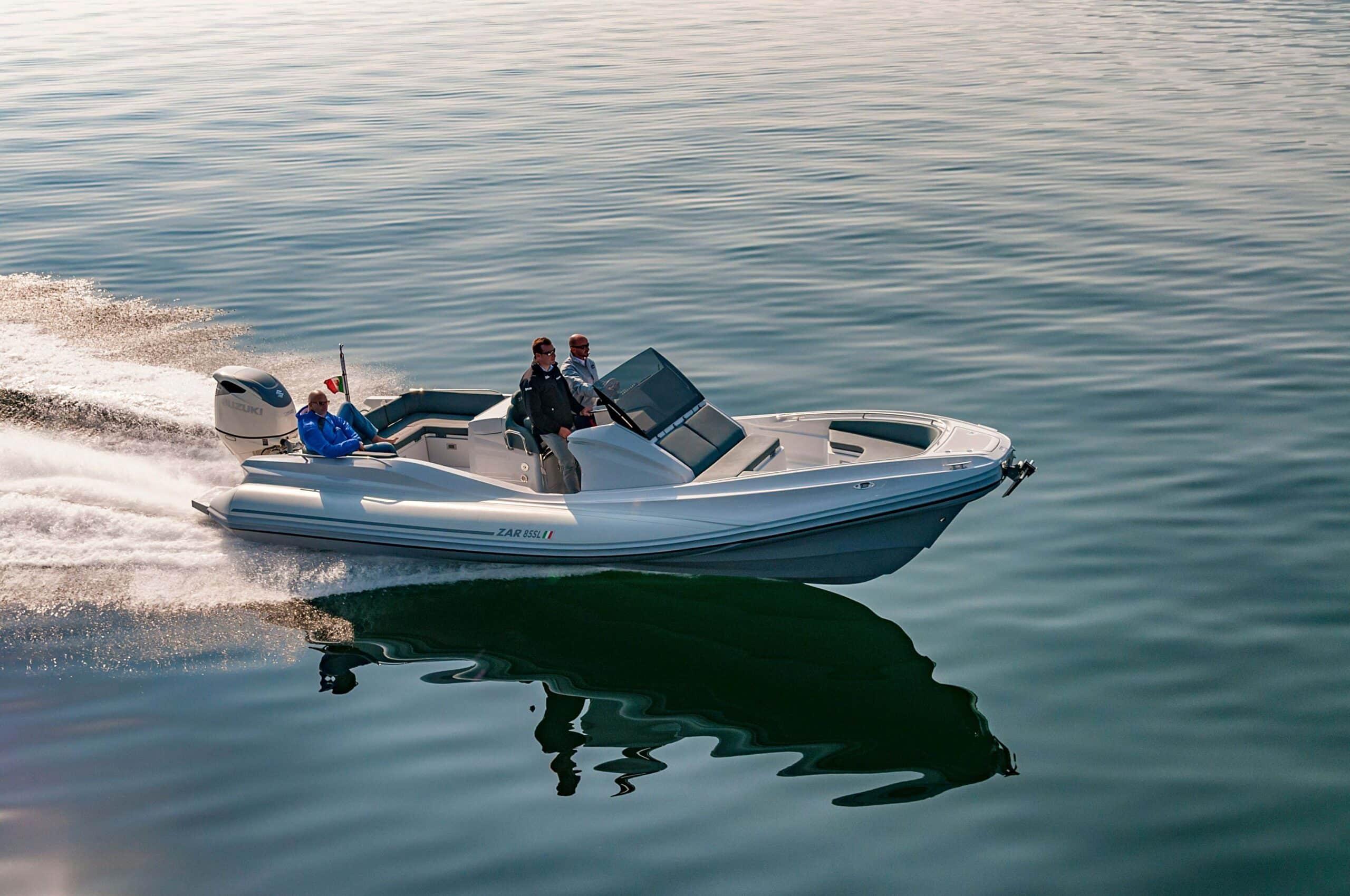 Zar Formenti ZAR Sport Luxury 2024 ZAR Sport Luxury boat cruising on calm water, showcasing sleek design and performance.