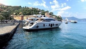 Pershing 64 Luxury Pershing 64 yacht docked in scenic coastal harbor, 2011 model.