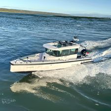Axopar 28 CABIN 2022 Axopar 28 CABIN boat cruising on open water.