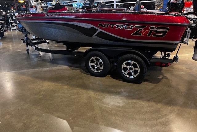 Nitro ZV19 Sport 2025 Nitro ZV19 Sport boat on display in showroom, red and black design.