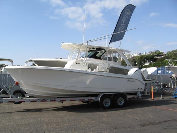 Edgewater 245CC 2023 Edgewater 245CC boat on a trailer at a marina.