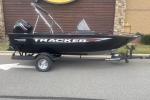 Tracker Pro Guide V-175 Combo 2026 Tracker Pro Guide V-175 Combo boat on trailer, black exterior, parked outdoors.