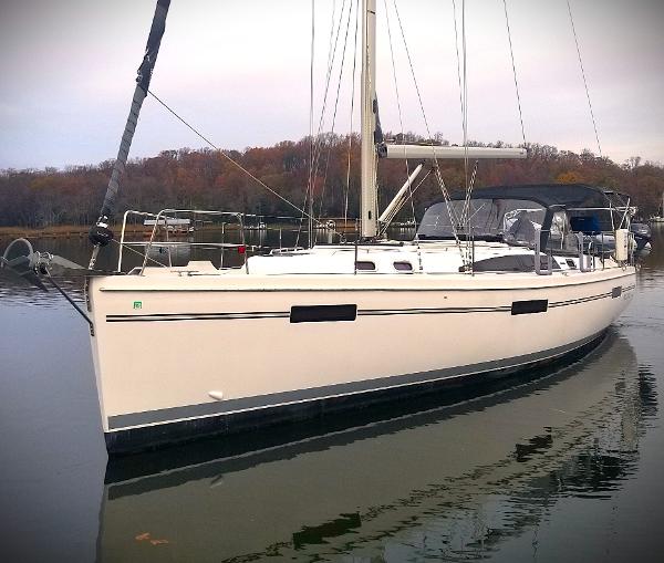 Catalina 425 2019 Catalina 425 sailboat on calm water, surrounded by autumn trees.