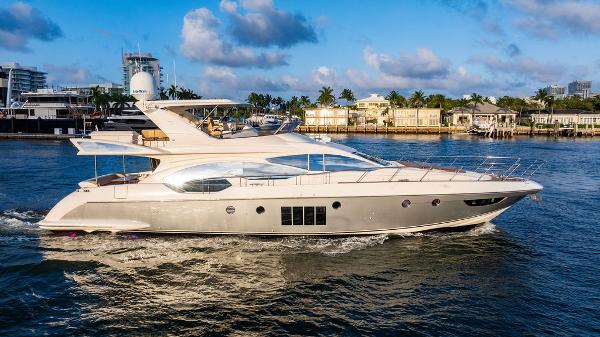 Azimut 70 Fly Luxury 2011 Azimut 70 Fly yacht cruising on a sunny day near a marina.