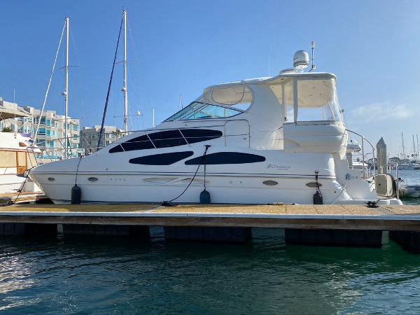 Cruisers Yachts 405 Express Motoryacht 2005 Cruisers Yachts 405 Express Motoryacht docked at marina under clear blue sky.